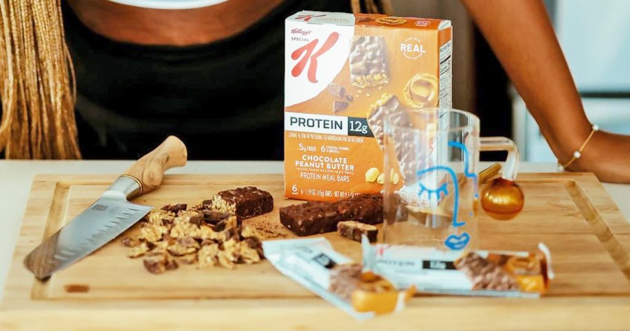 box of Special K Protein Meal Bars on cutting board with cut up pieces of bars