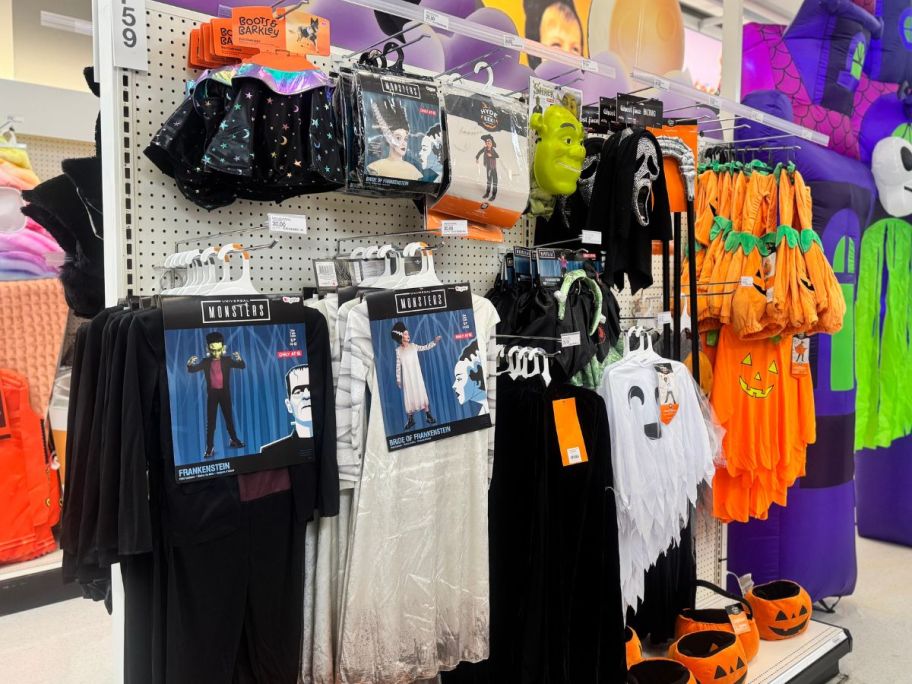 Several halloween costumes in a store