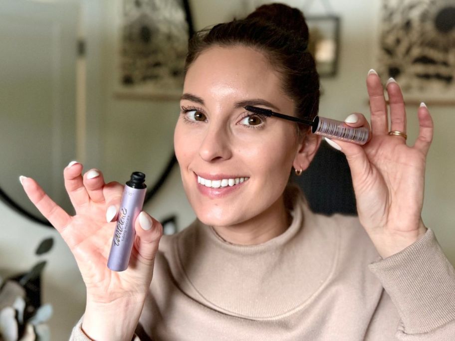 Woman applying a Tarte Tubing Mascara to her eyelashes