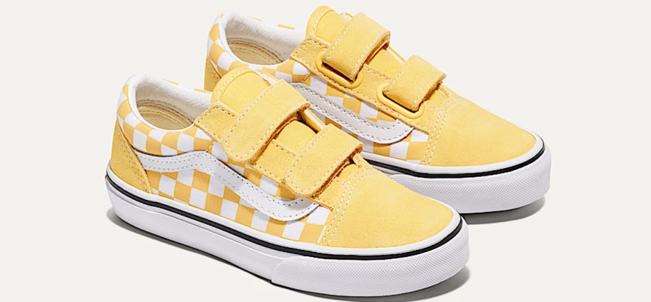 pair of yellow and white checkerboard print velcro shoes