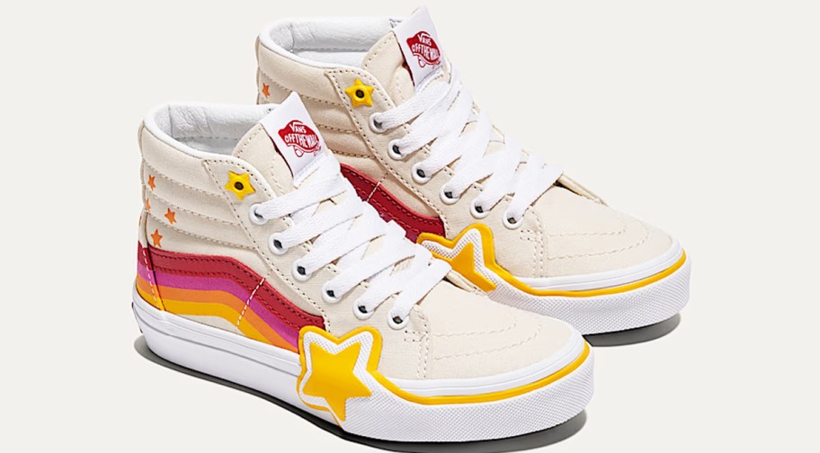 pair of tan sneakers with colorful shooting stars