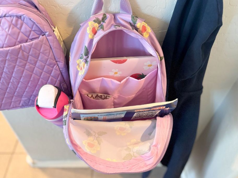 The inside of a vera bradley backpack