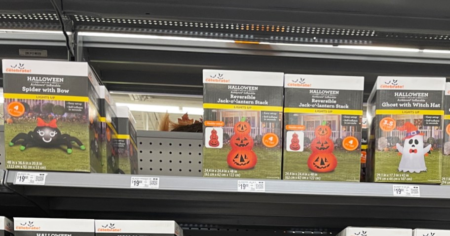 boxes of halloween inflatables on store shelf
