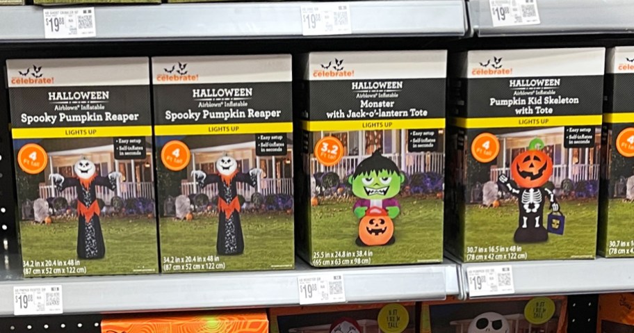boxes of halloween inflatables on store shelf
