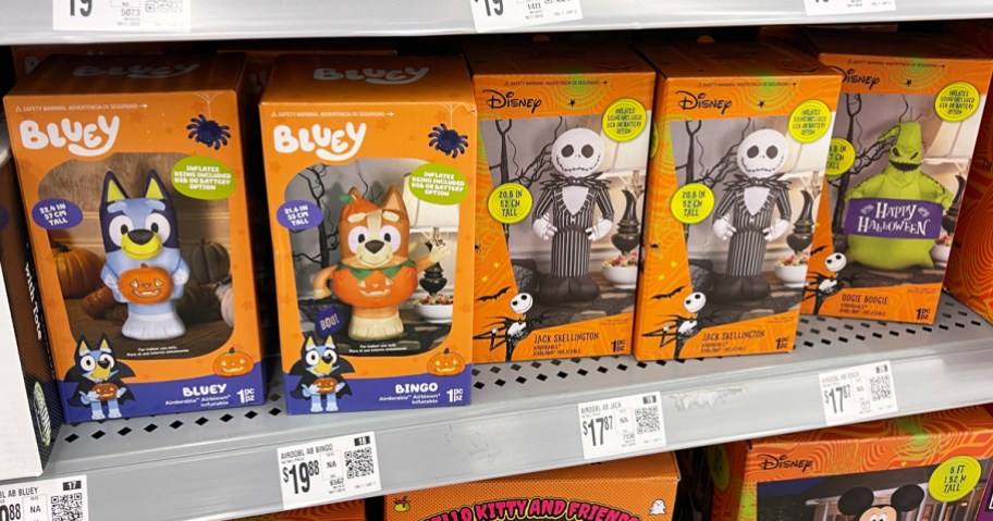 boxes of halloween inflatables on store shelf