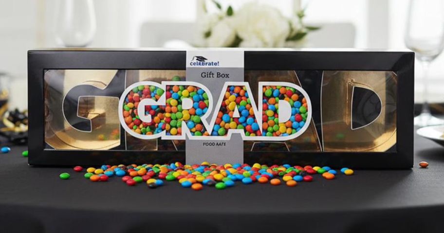 A Way to Celebrate Grad Snackle Box on a counter with colorful candies