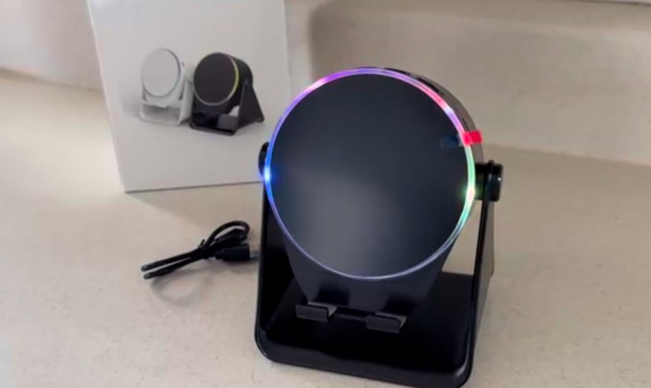 bluetooth speaker with rainbow light on counter 