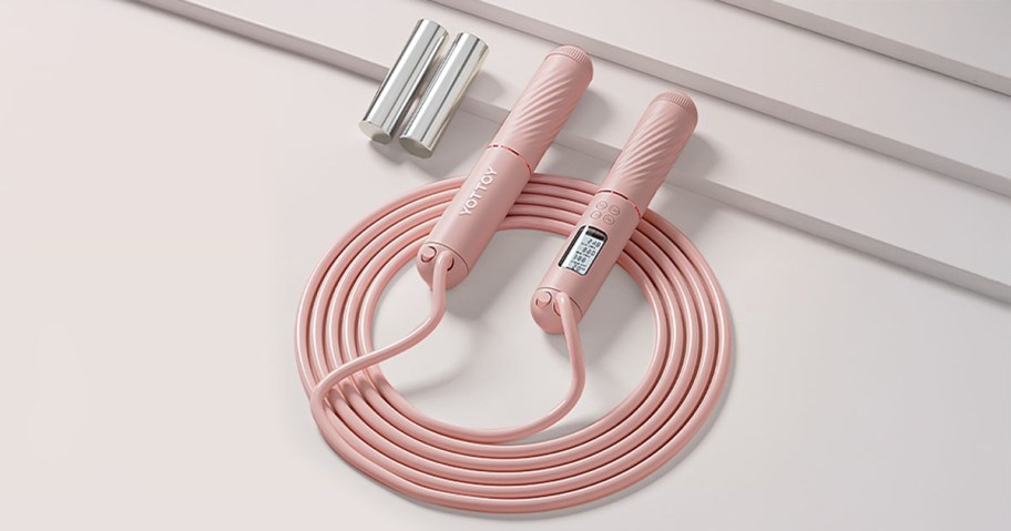 Yottoy Smart Jump Rope w: LED Display in Pink laying on a table