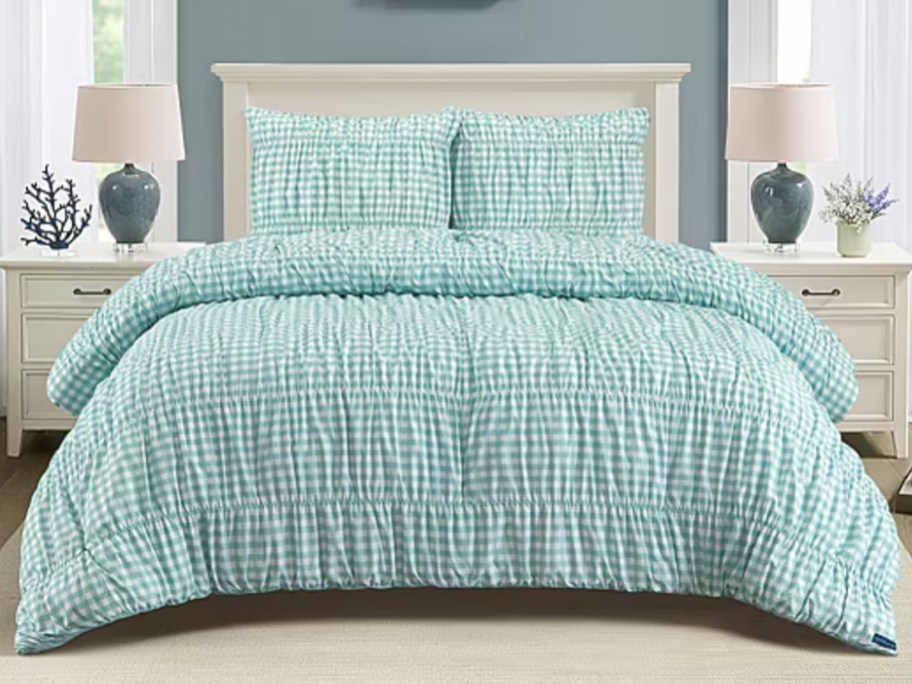 green and white gingham comforter set on bed
