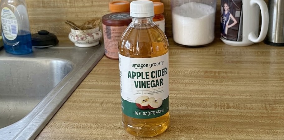 apple cider vinegar bottle on table