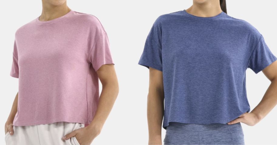 two women wearing Athletic Works ButterCore Cropped Tees in pink and blue