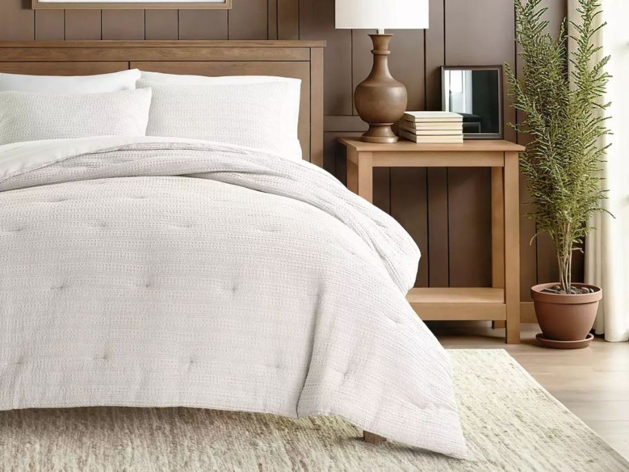 beige comforter and shams on bed