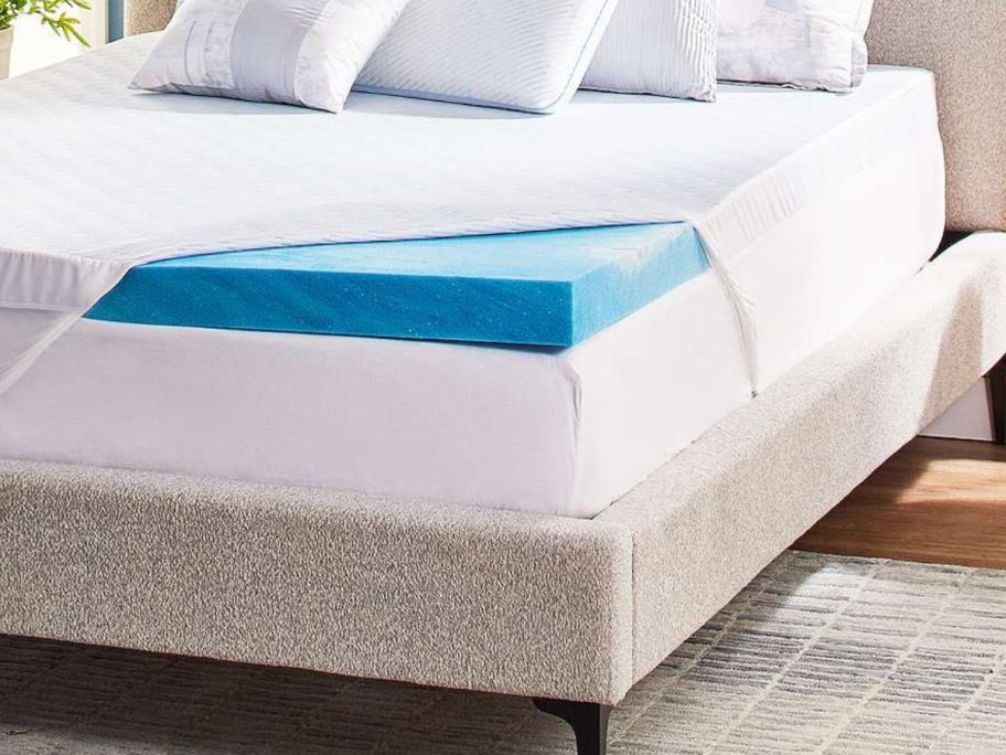 blue mattress topper on bed