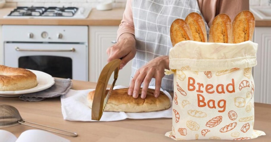 woman slicing bread behind a bread bag full of baguettes