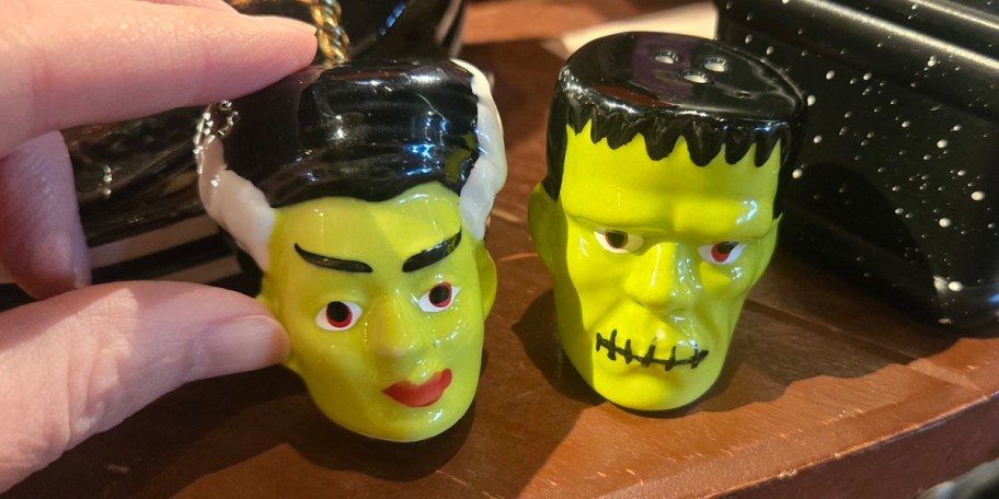 two monster salt and pepper shakers 