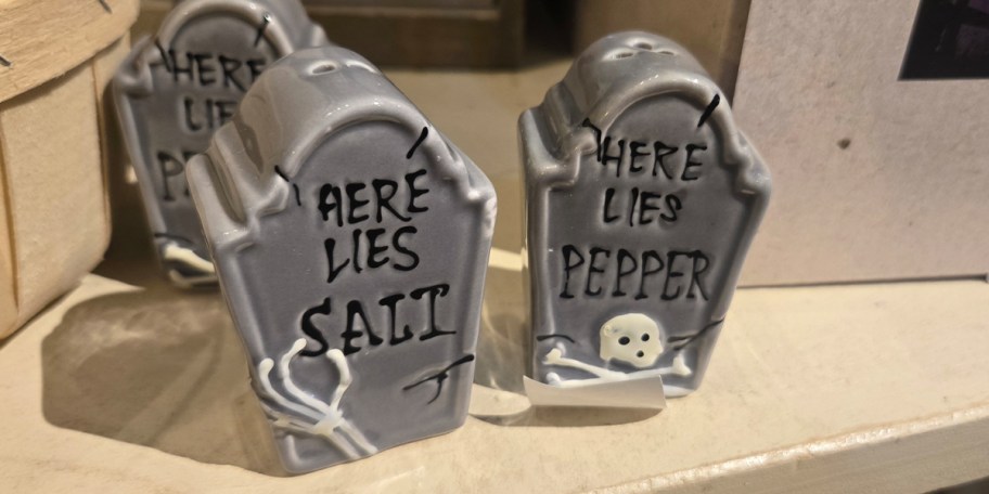 two tombstone salt and pepper shakers 