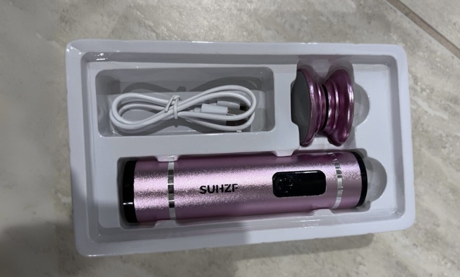 electric foot file in box with attachments and charging cord.