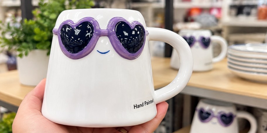 hand holding ghost mug
