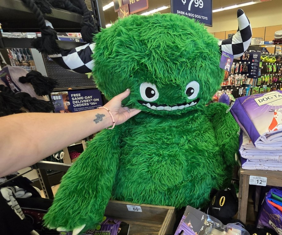 a giant green monster plush dog toy