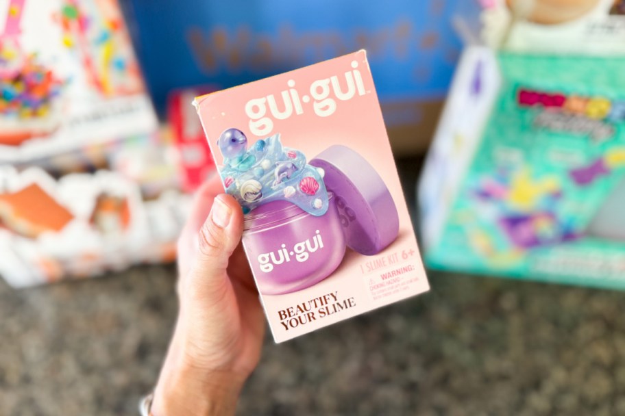 hand holding small box of slime kit