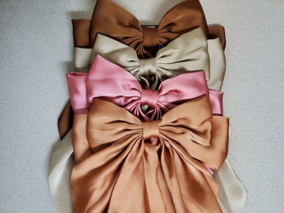 four hair bows on table