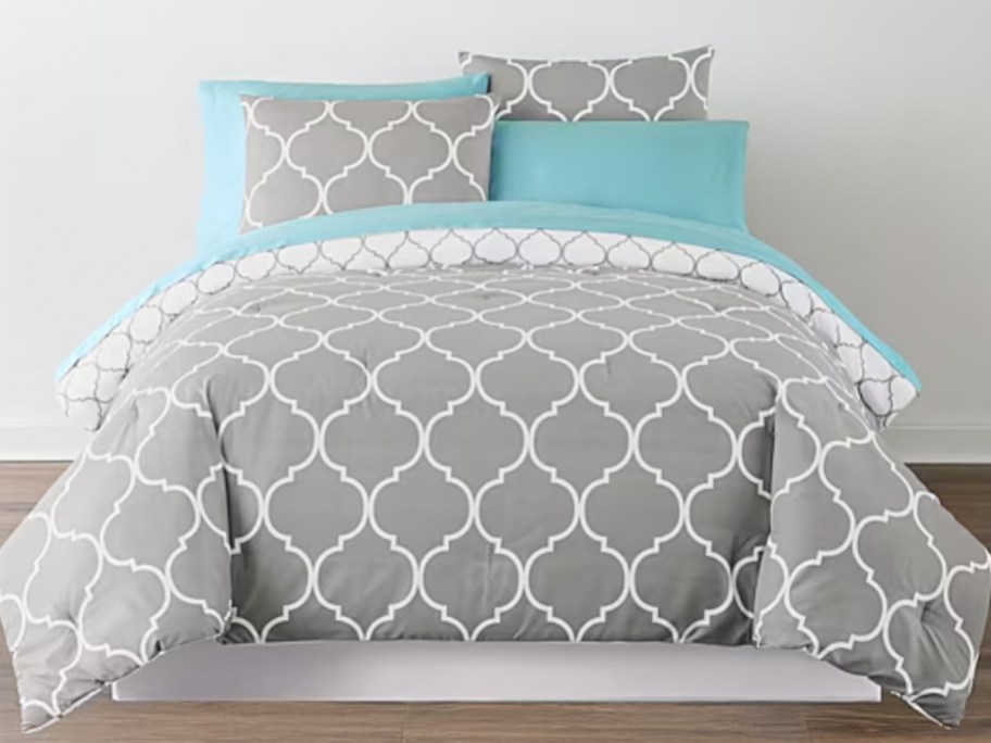 gray comforter set on bed