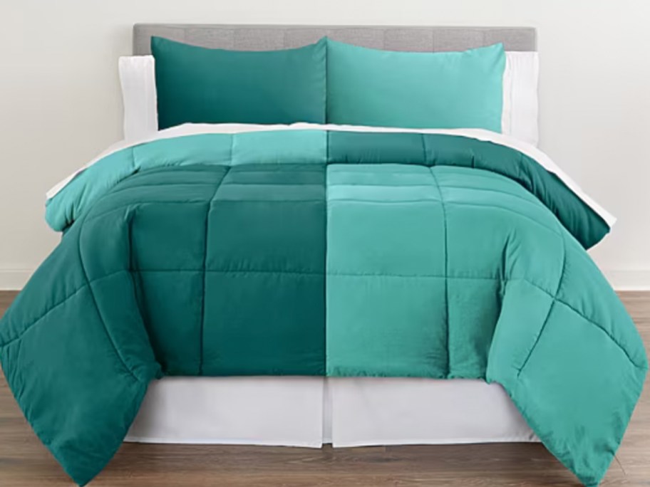 green comforter on bed