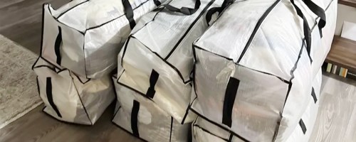 six moving bags stacked together