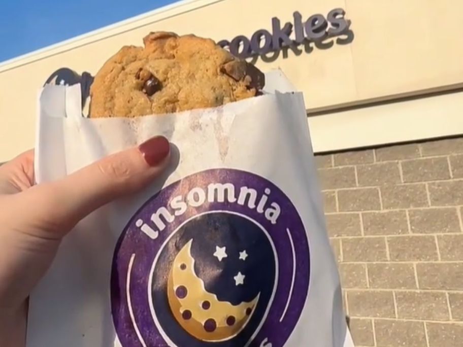 holding a cookie in an insomnia bag