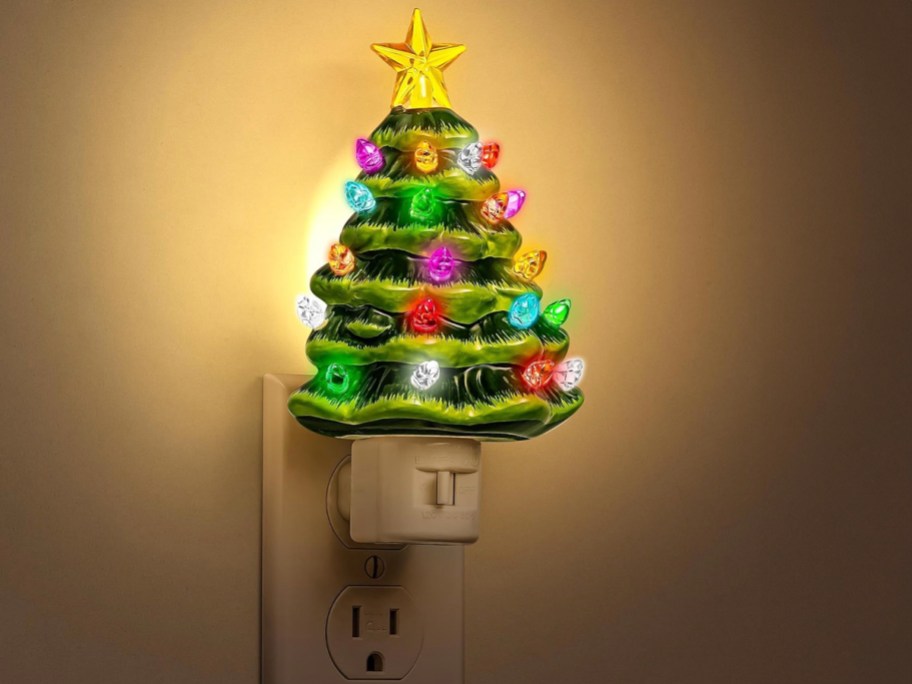christmas tree night light in outlet on wall