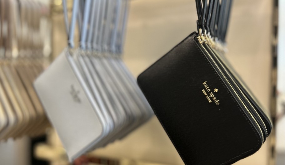 Kate Spade wristlets hanging in a store
