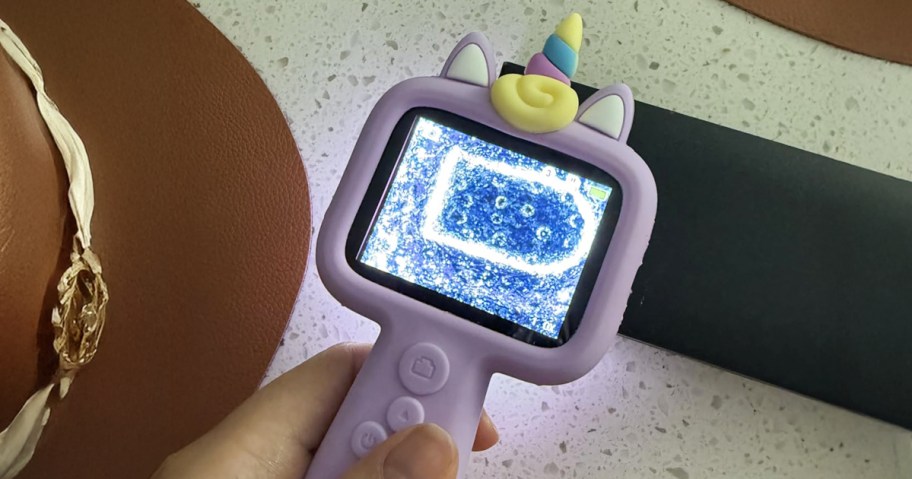 person using a microscope to look at something