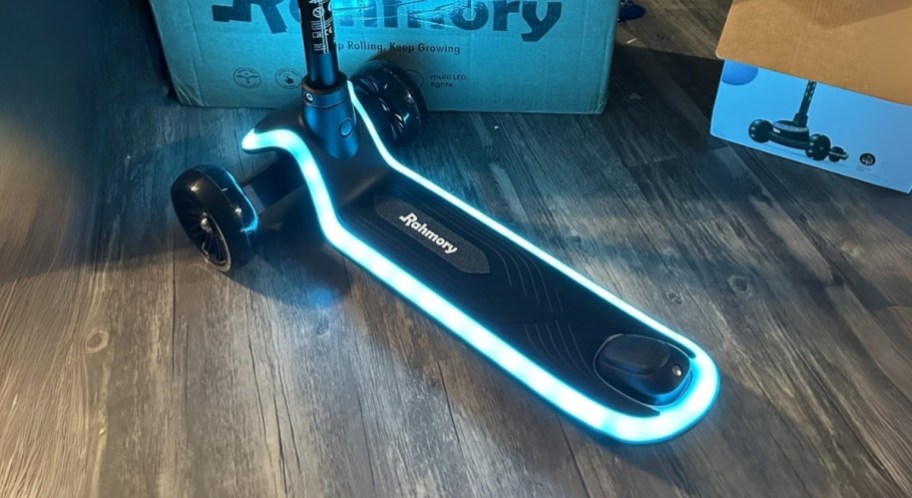 a kids light up scooter with glowing blue lights