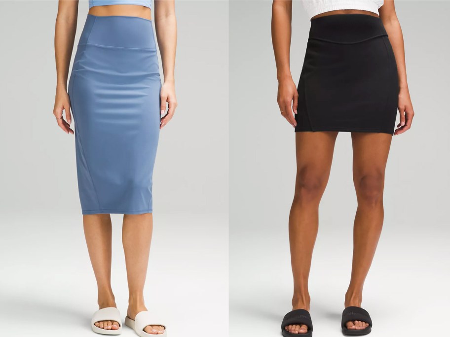 two women modeling blue and black skirts