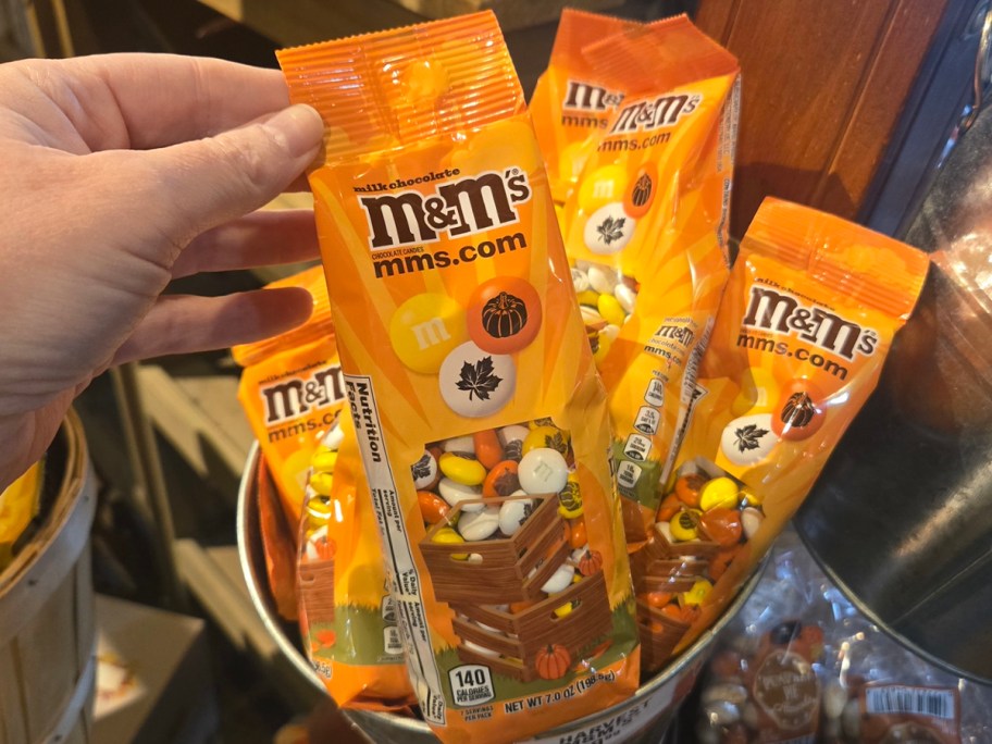 hand reaching for M&m's bag 