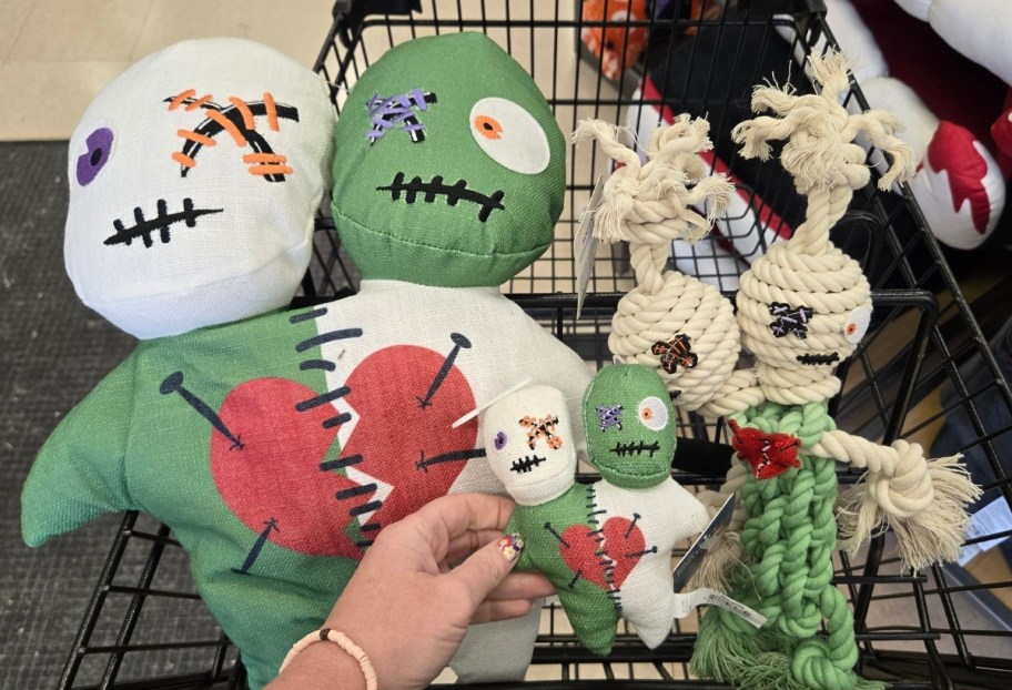 3 2 headed mummy dog toys in a shopping cart