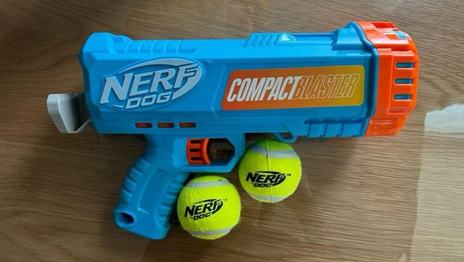 compact nerf blaster with balls on table