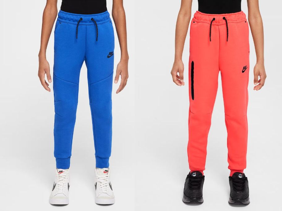 two kids wearing blue and orange nike sweatpants