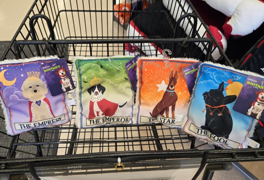 4 plush taqrot card dog toys in a cart