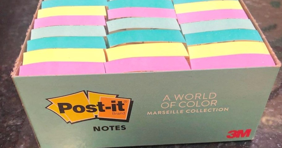 Box of colorful Post-it notes from the Marseille Collection by 3M, featuring pink, yellow, and teal pads. The packaging reads &ldquo;A World of Color.&rdquo;