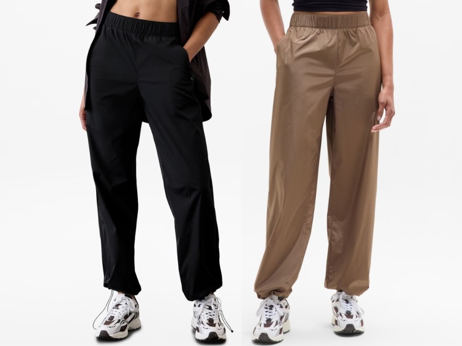 two women wearing track pants