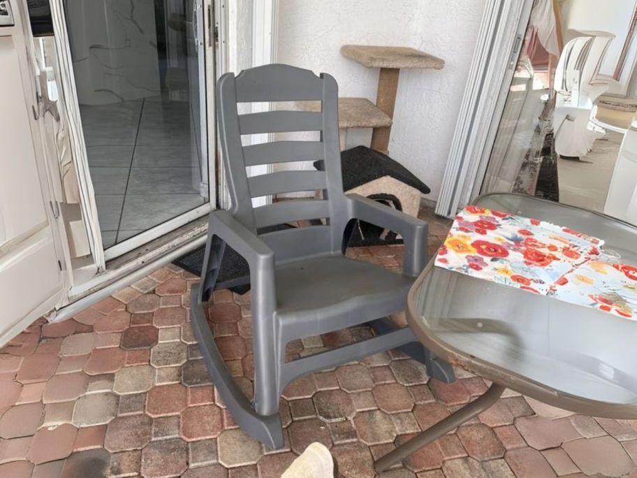 grey rocking chair on patio