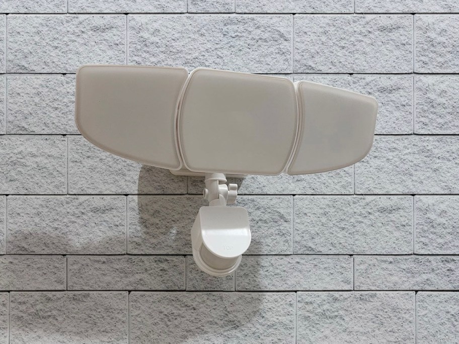 white secruity light hanging on wall