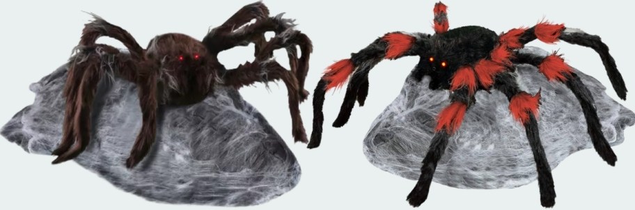 two large animatronic spiders
