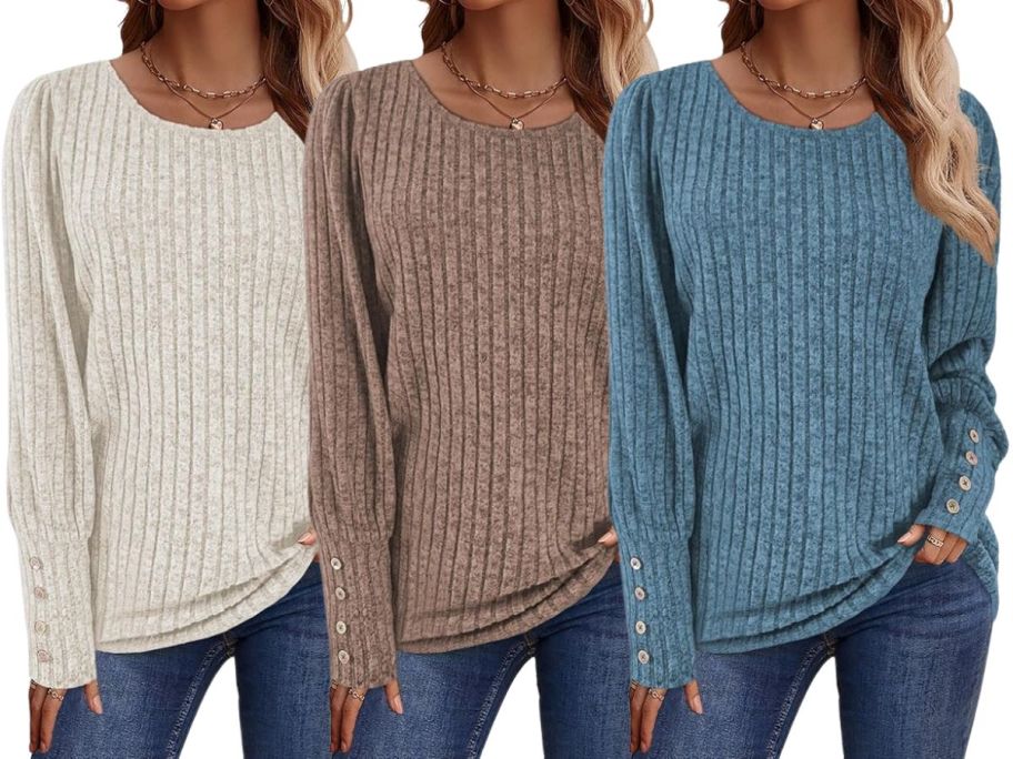 three women wearing sweaters in beige, brown, and blue