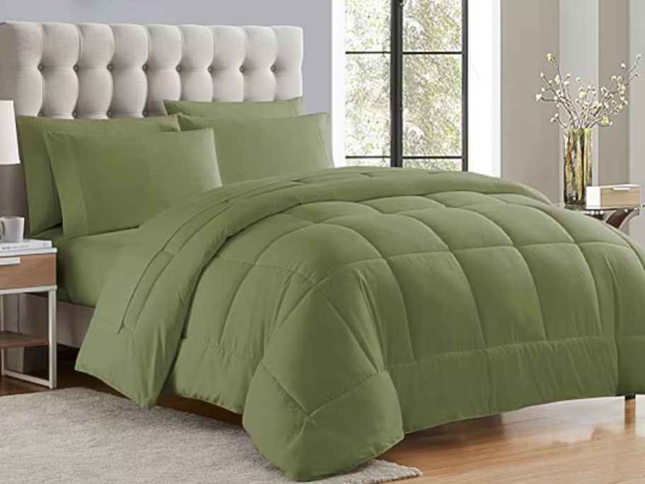olive green comforter on bed