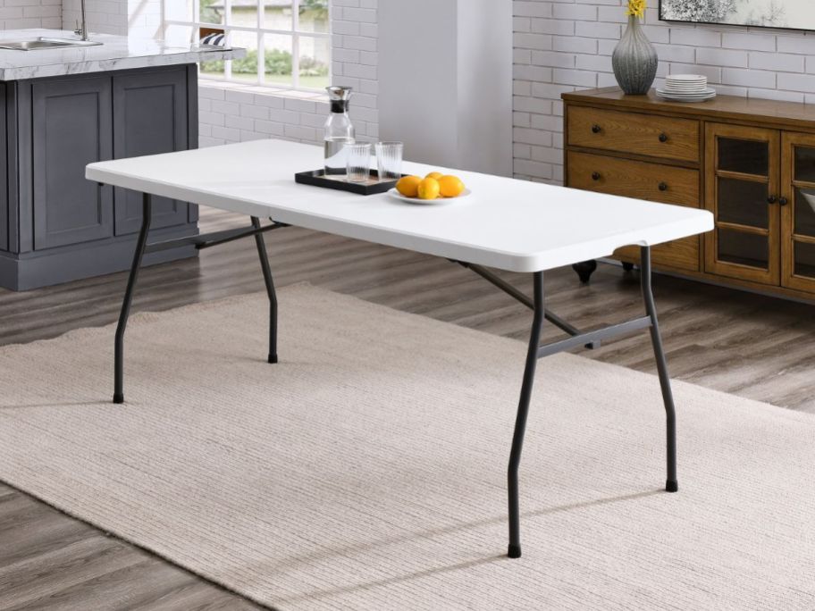 6 foot white table in dining room