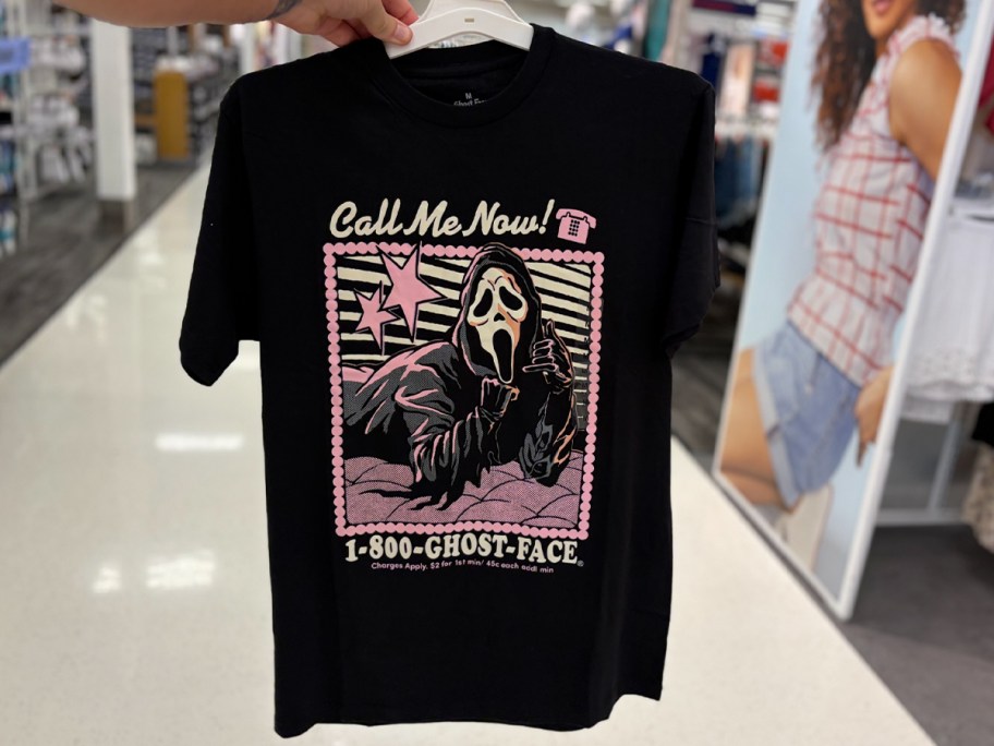 hand holding ghost face tee 