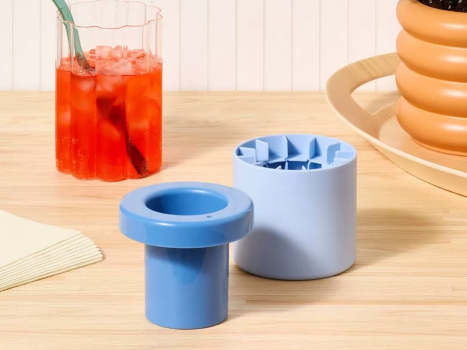 blue crushed ice mold on table with red drink