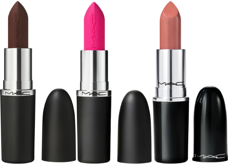 Three open MAC lipsticks in dark brown, bright pink, and peach, standing upright next to their black caps.
